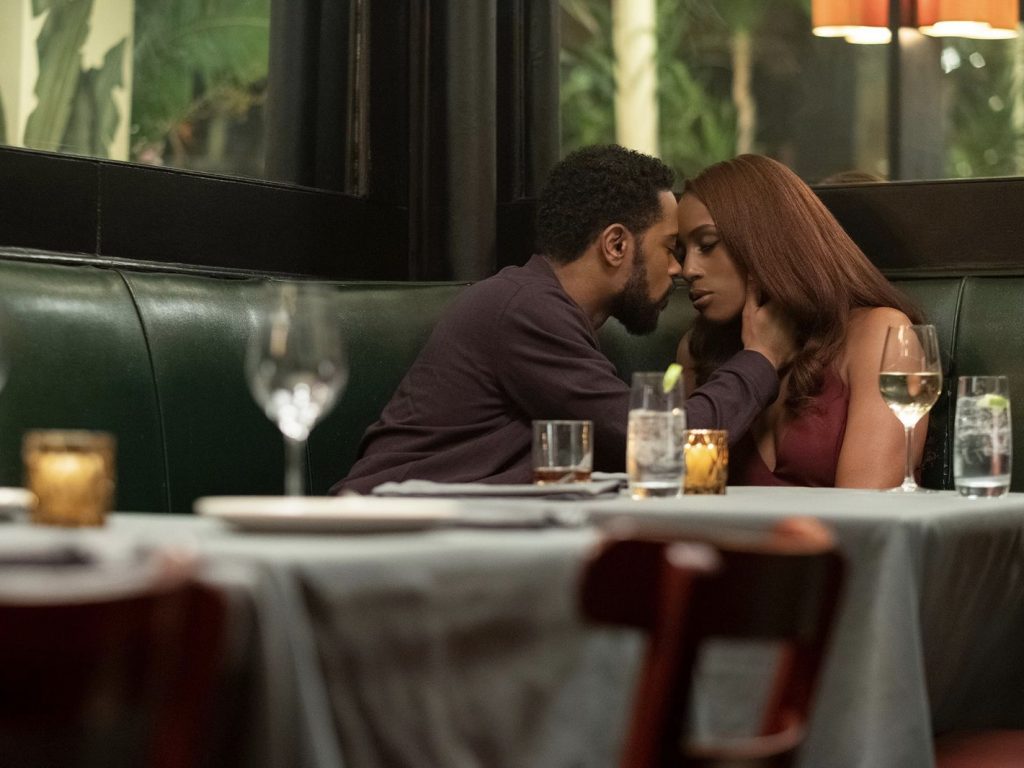 Characters from "The Photograph" in a restaurant.