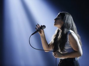 Lorde singing on stage