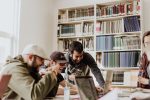 Students in library in an article about getting a student loan