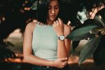 A woman stares at her watch; the biological clock is always ticking, and for some people, egg freezing is a great way to fight back