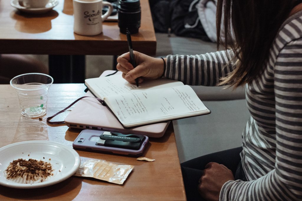 picture of student doing homework in an article about earning money while in school