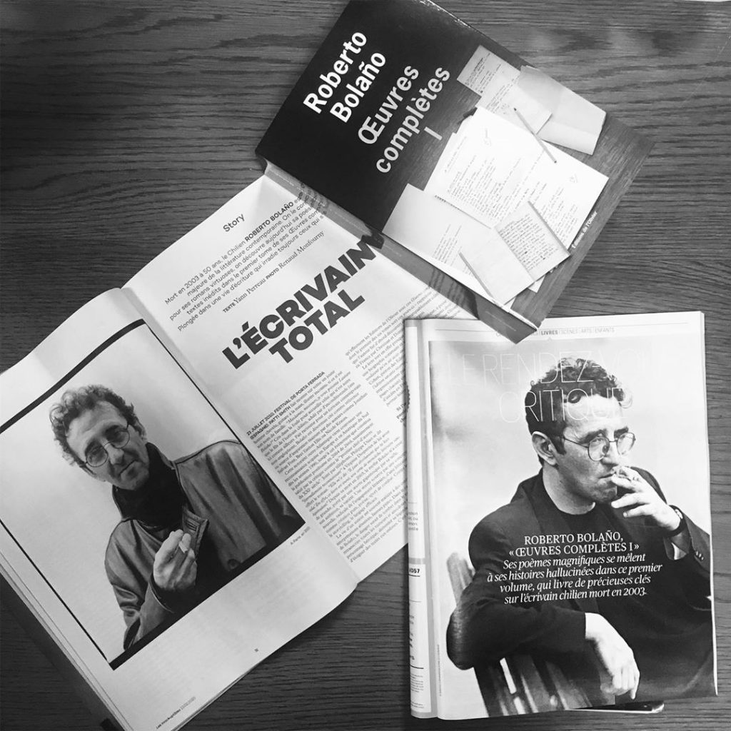 Photo of a Roberto Bolano book along with magazine articles about the author
