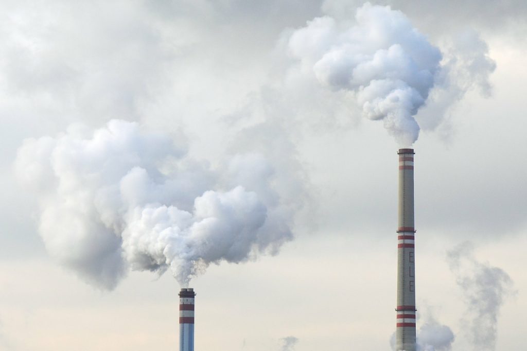 Smoke coming out of building chimneys