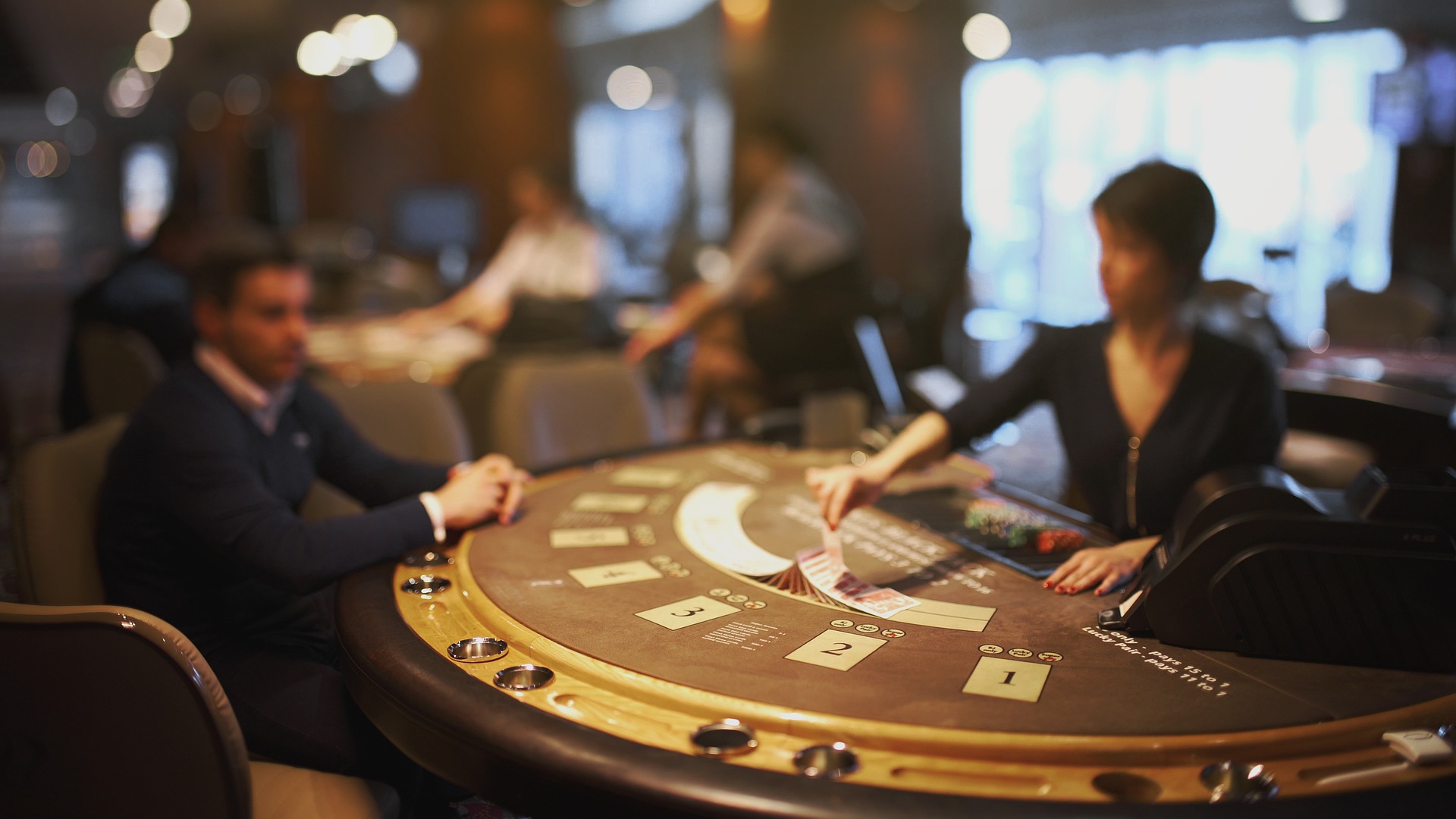 Man at blackjack table in article about no deposit bonuses