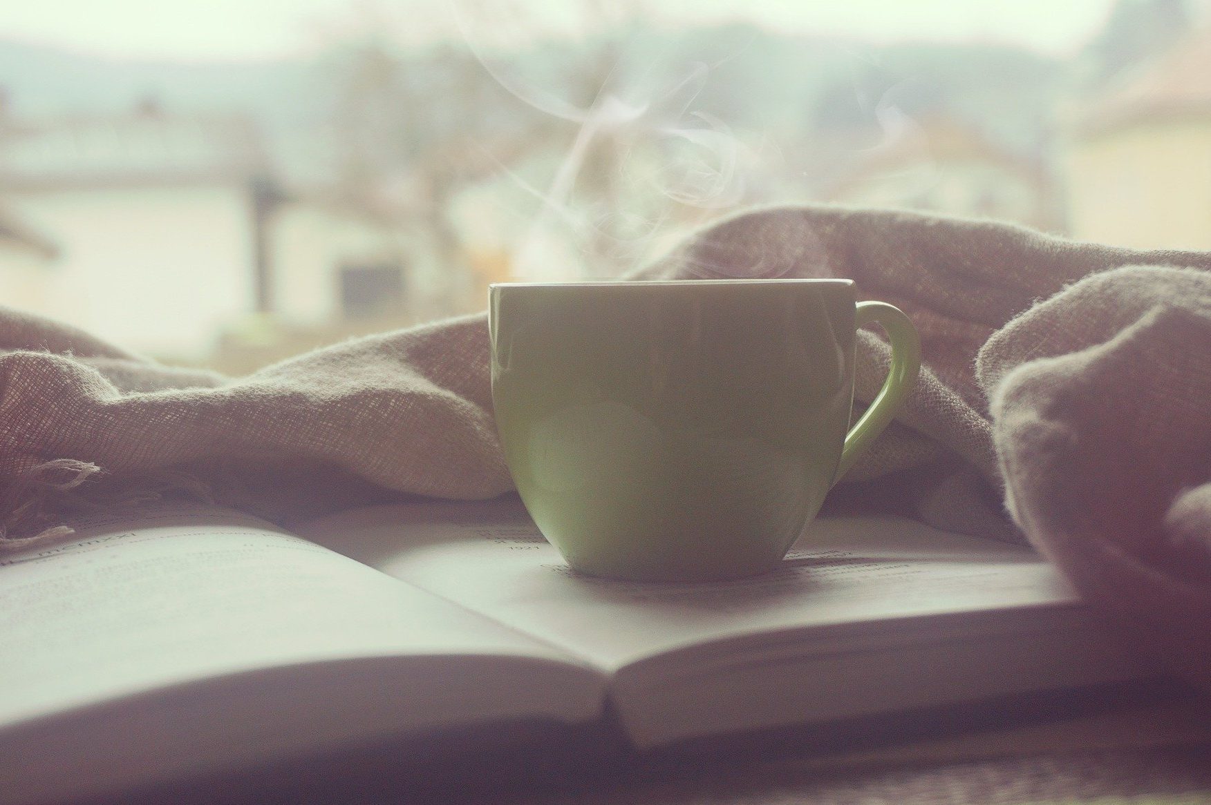 cup of coffee in article about needing to stay positive in quarantine