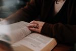 In an article about self-care during quarantine, an image of a woman reading a book