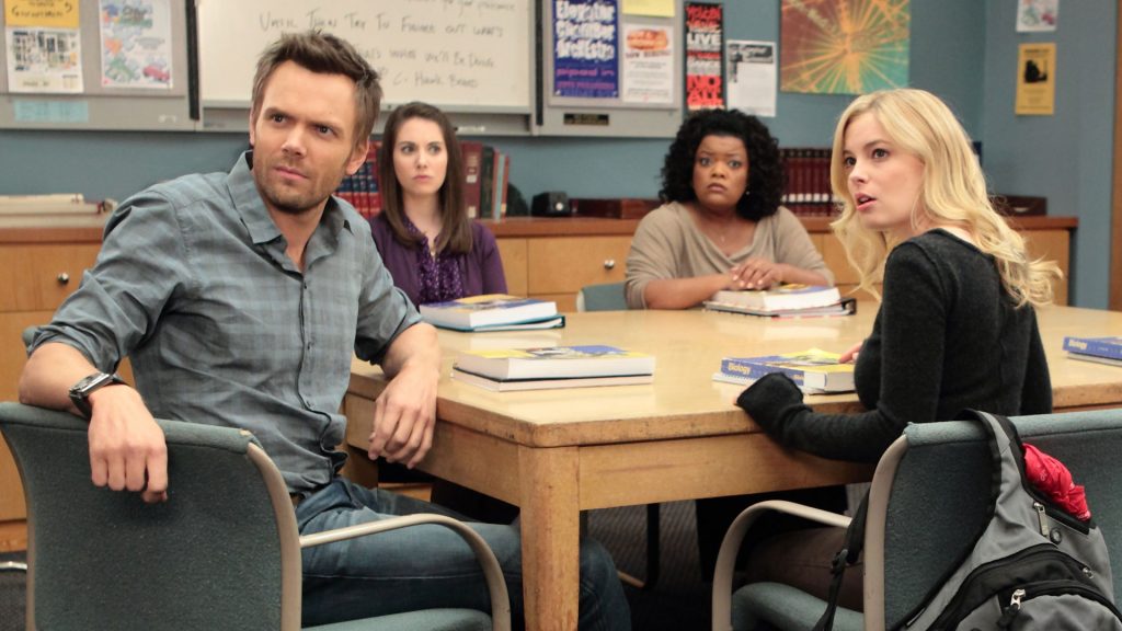 Characters from the show Community sitting at a table