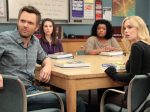 Characters from the show Community sitting at a table