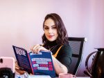 Image of woman at a desk language-learning