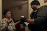 Image of a woman and a government agent in the docuseries Immigration Nation