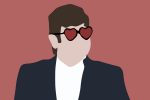 Elton John wears heart shaped glasses.