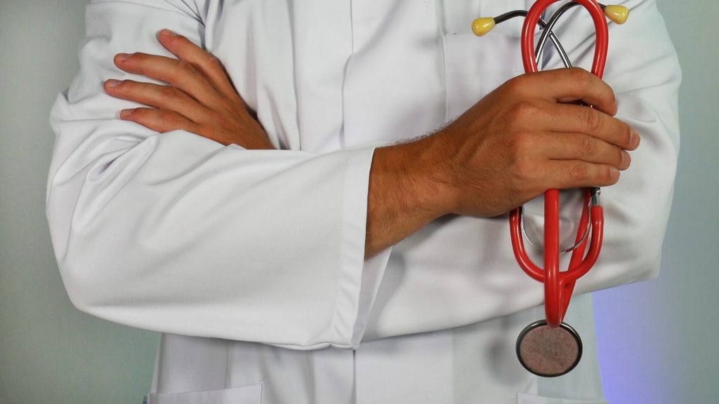 In an article about the coronavirus and living with parents in the medical profession, a photo of a doctor holding a stethoscope