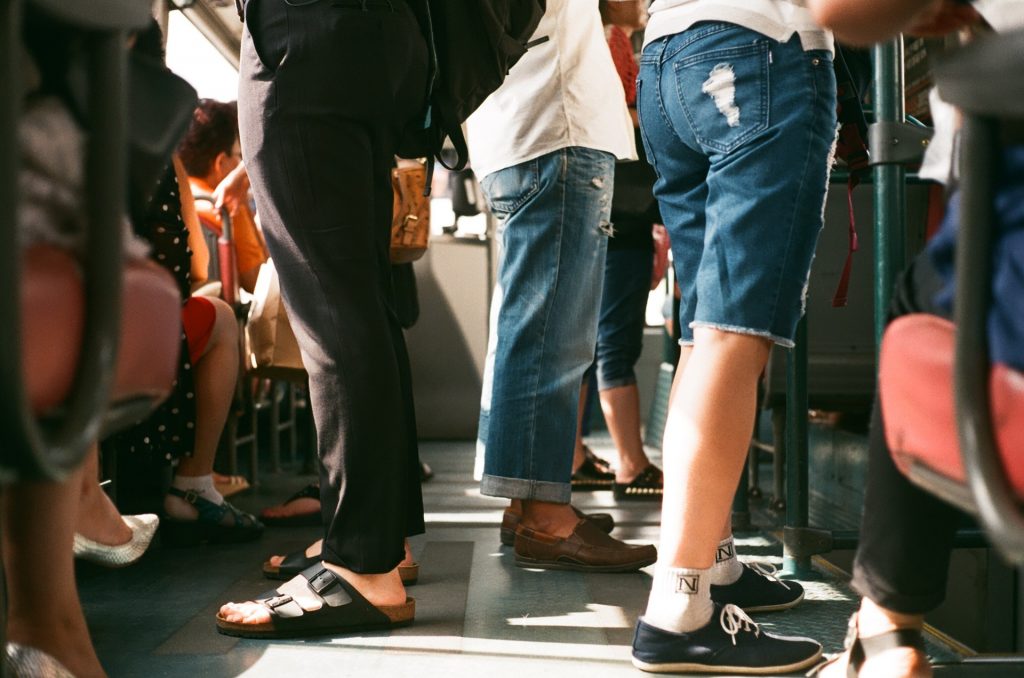 In an article about Greek life, a group of students photographed from the waist down