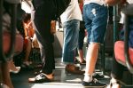 In an article about Greek life, a group of students photographed from the waist down
