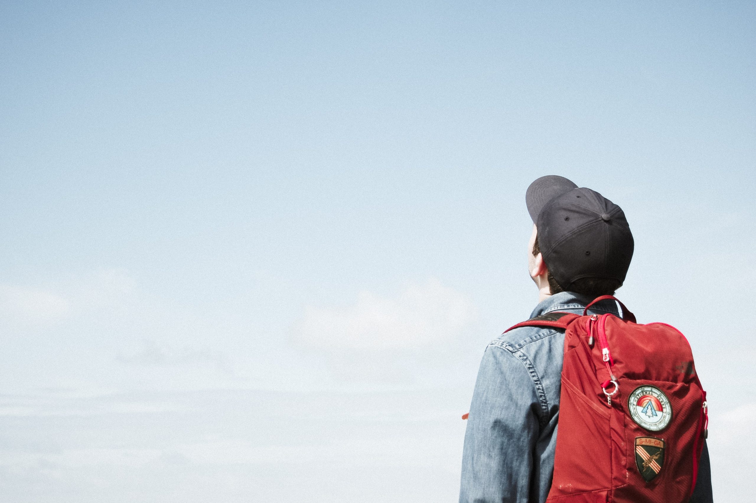 Student looking up into the sky, perhaps considering nonlinear learning.