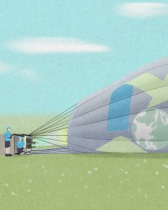 In an article about Sustainability Development Goals, Balloon With An Earth Logo Falling Over