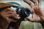 Image from YouTube channel Great Big Story of a man using a camera to take a picture.