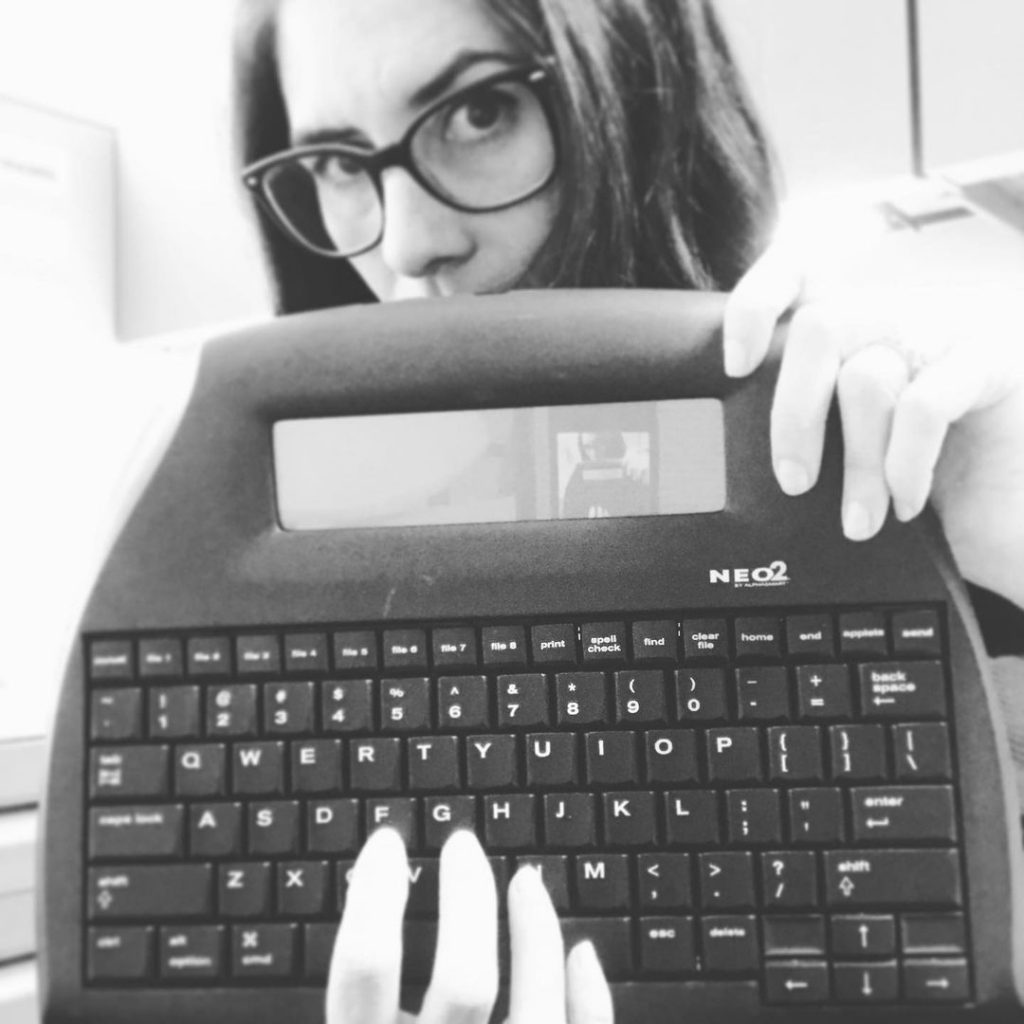 In an article about sapphic novels, author Wendy Heard with a typewriter