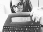 In an article about sapphic novels, author Wendy Heard with a typewriter