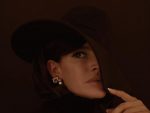 Photo of Frassy Audrey wearing a large hat