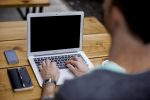 In an article about professions, a person at a laptop