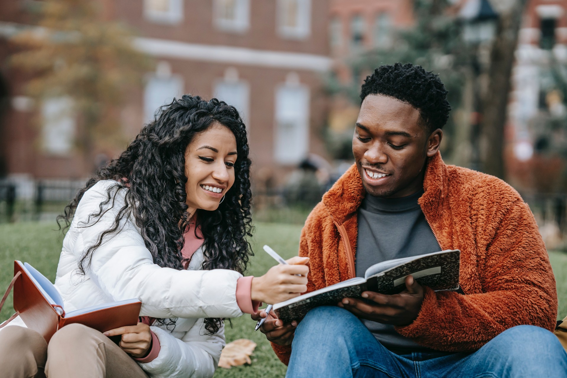 In an article about studying abroad, two people looking at a notebook