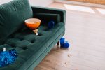 in an article about sports betting, an empty couch with empty cups and an empty cup