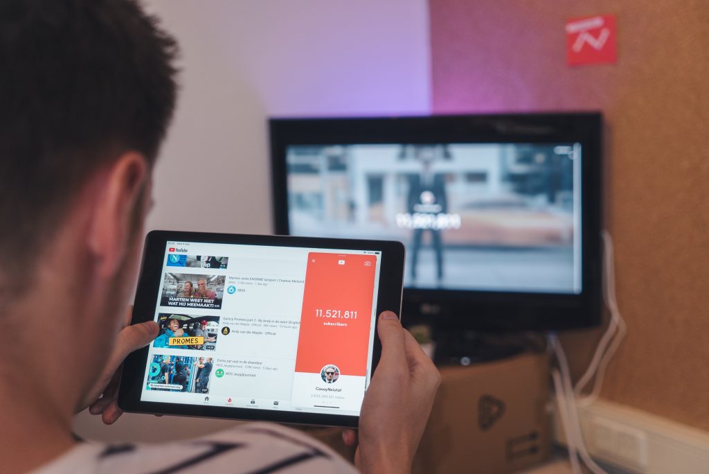 someone watching YouTube on a tablet