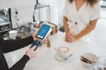 credit card being used in article about themes