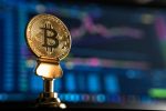 bitcoin in front of computer in article about proof of burn