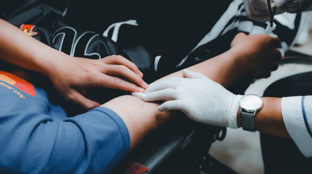 in an article about bloodborne pathogens, blood being drawn