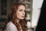 Charlie Bradbury, one of the female characters from "Supernatural," is shown frowning at a male character offscreen.