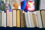 Photograph of the bottom of books lined up in a row