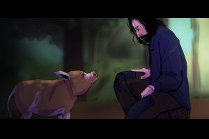 In an article about the movie Pig, a man kneels in front of a pig in the woods.