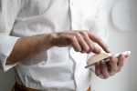 In an article about SEO, a person on their smartphone