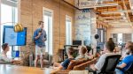 in article about leads, someone standing in front of other people