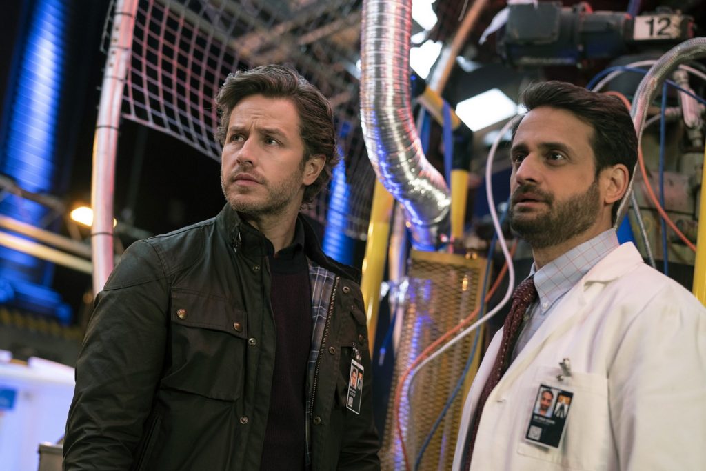 A screenshot from the show 'Manifest' of two male characters standing next to each other.