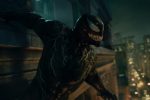 Venom 2 screenshot, of Venom hanging from a building