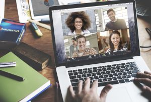 A computer has Zoom open on the screen.