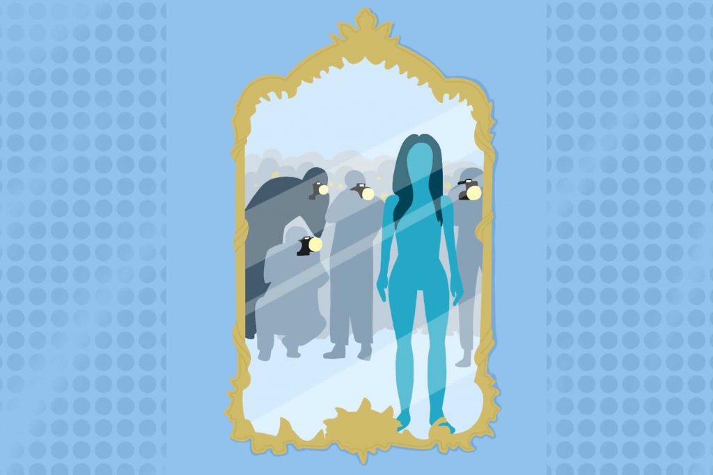 A woman in a mirror while being photographed for an article on My Body