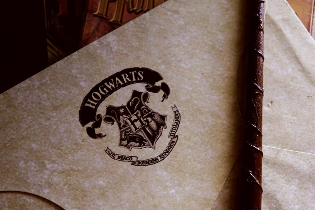 Photo of Hogwarts letter and wand in article about J K Rowling