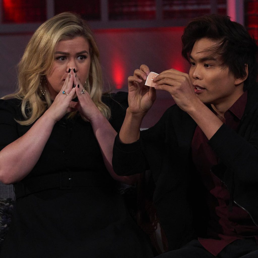 Shin Lim on America's Got Talent next to Kelly Clarkson