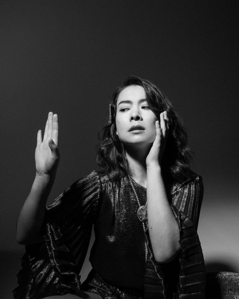in article about Laurel Hell, a photograph of Mitski