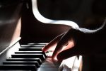 hand playing the piano