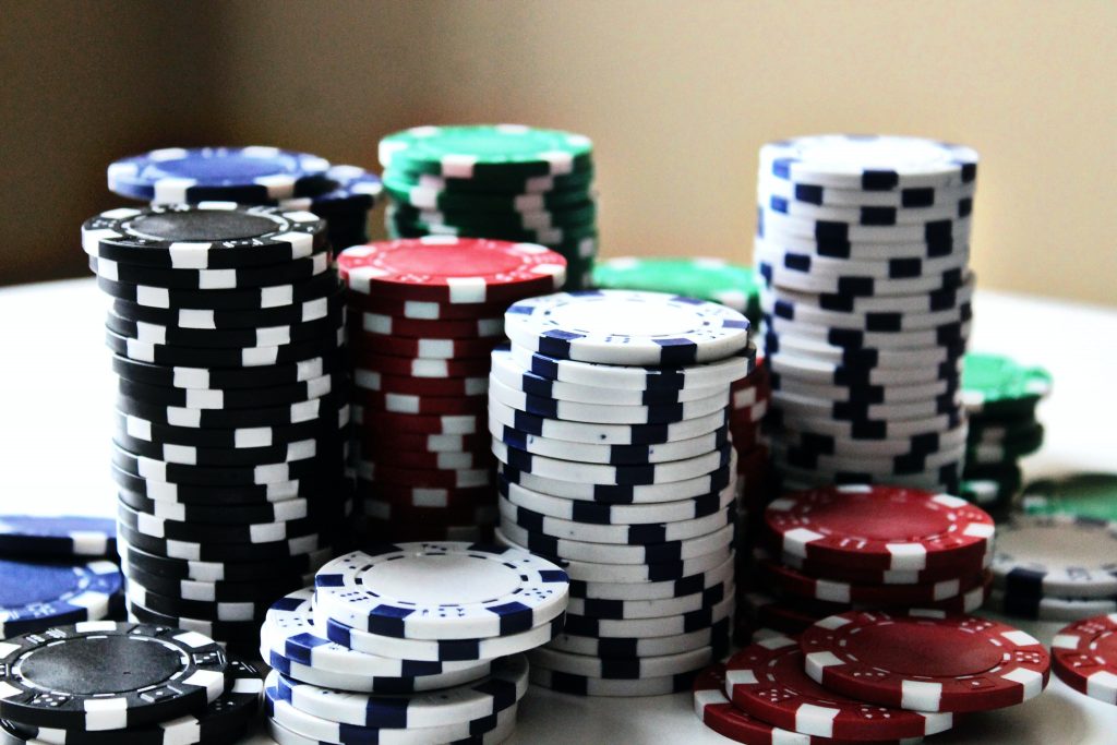 in an article about the online casino, a pile of chips on a table