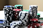in an article about the online casino, a pile of chips on a table