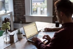in article about evidence-based practice, a person studying on their laptop