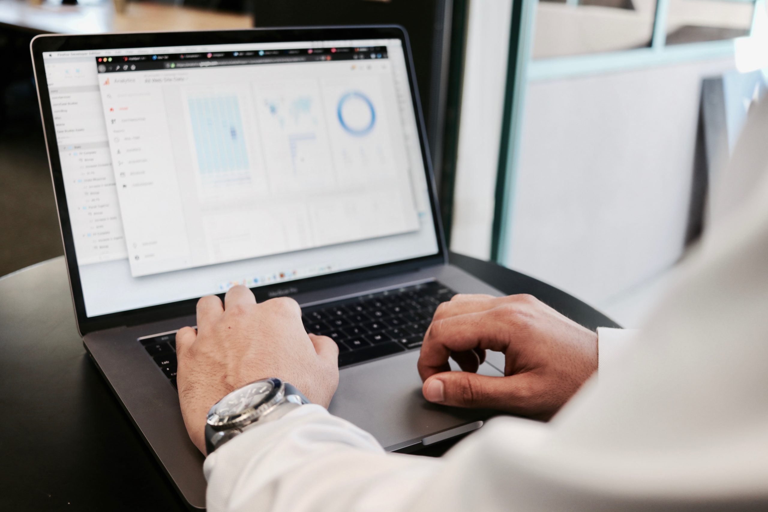 in article about starting a business that runs itself, a person's hands at a laptop