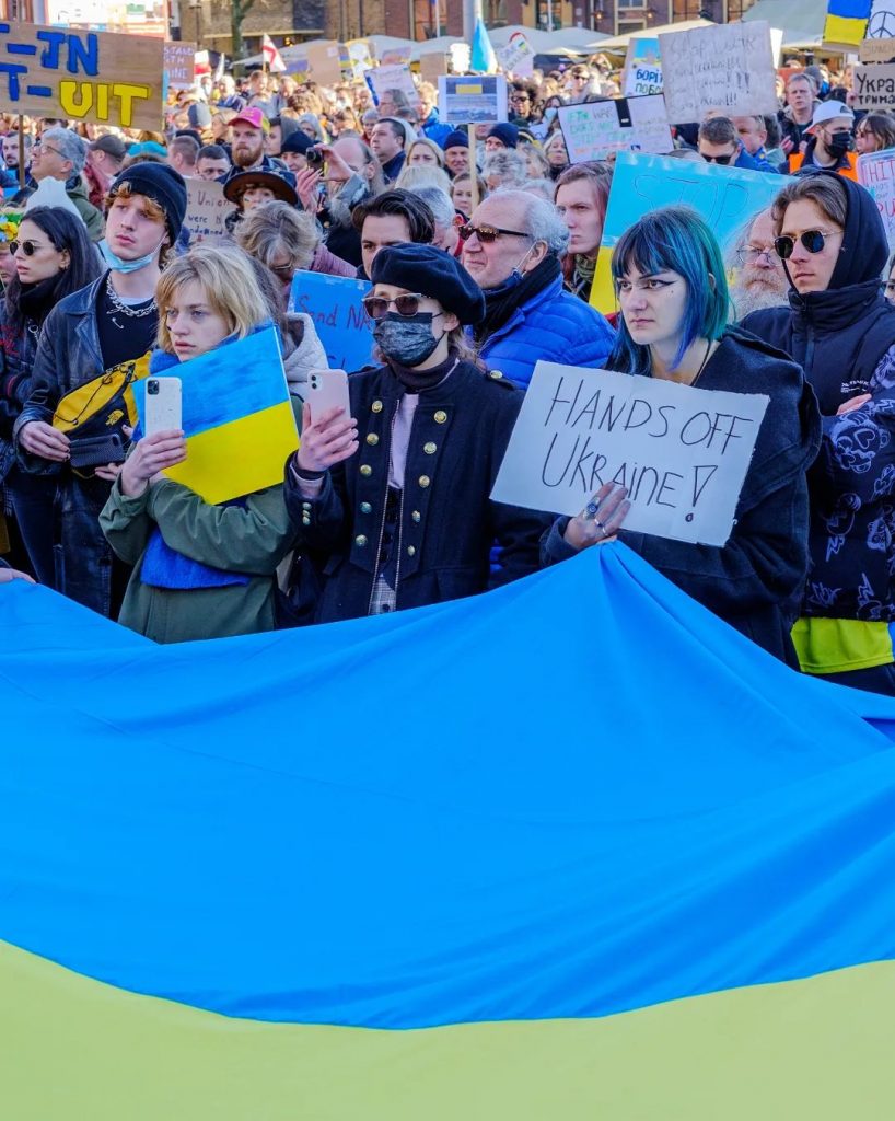 Protestors standing in solidarity with Ukraine against Putin's invasion