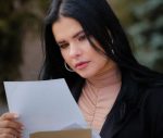 college dropout looking at paper concerned